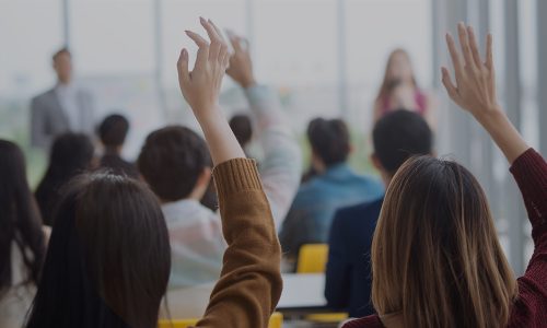 Image of Two People With Raised Hands